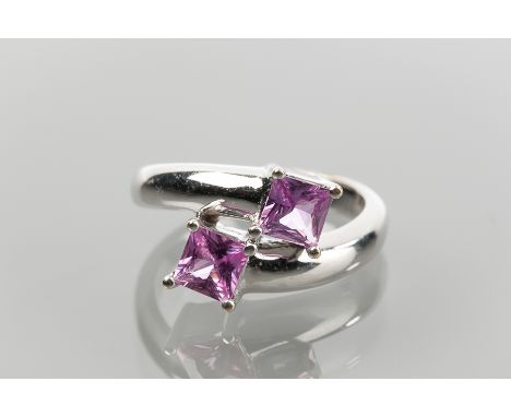 PINK TOURMALINE TWO STONE CROSSOVER RING set with two square cut tourmaline in an interlinking crossover setting, hallmarked 