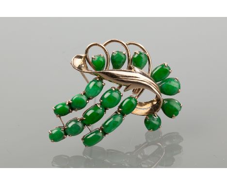 FOURTEEN CARAT GOLD JADE SET HOLBEIN BROOCH 
of stylised foliate design, set with seventeen cabochon cut jade stones, marked 