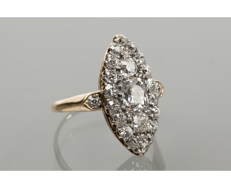 IMPRESSIVE MARQUISE SHAPED DIAMOND CLUSTER DRESS RING 
with brilliant cut diamonds on diamond cut shoulders totalling approxi