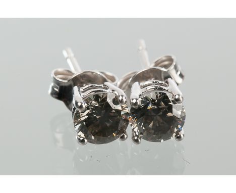 PAIR OF DIAMOND STUD EARRINGS
the diamonds totalling approximately 1.40 carats, unmarked, the butterflies marked 750 for eigh