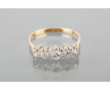 TWENTIETH CENTURY DIAMOND FIVE STONE RING
with graduated stones totalling approximately 0.25 carats, in eighteen carat gold