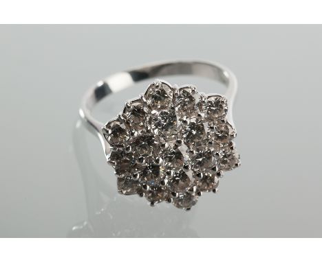 LARGE DIAMOND CLUSTER RING
of hexagonal form, the brilliant cut diamonds totalling approximately 3.50 carat, marked 18ct for 