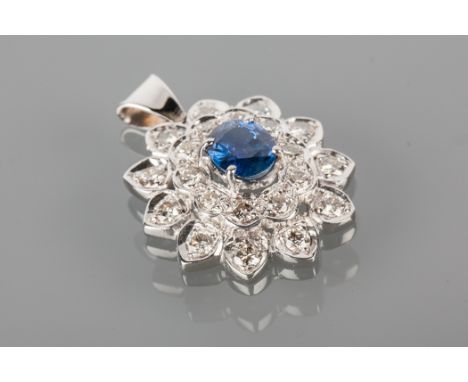 SAPPHIRE AND DIAMOND CLUSTER PENDANT
23mm high excluding bale, the central oval sapphire 7.4x6.3mm surrounded by two rows of 