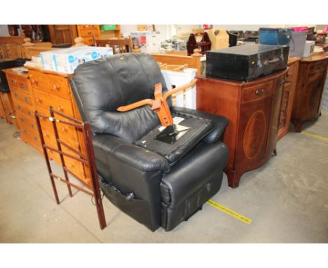 A Timotion rise and recline leather armchair with foot stool 