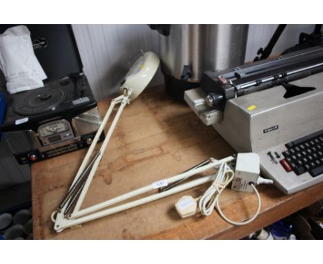 An Anglepoise style fluorescent magnifying lamp