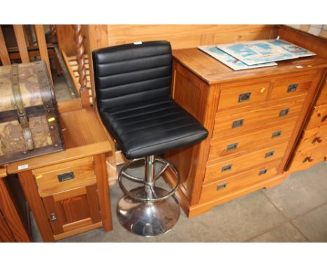 A leatherette upholstered and chrome based high stool