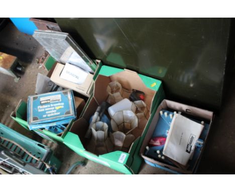 Three boxes containing various light shades and tools