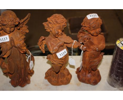 A garden ornament in the form of a cherub playing a violin