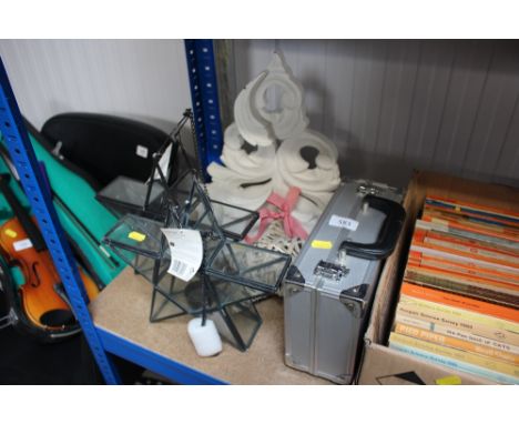 An aluminium case; together with a wall bracket; two candle lanterns etc