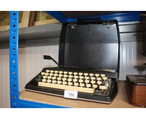 A Tippas portable typewriter in fitted case