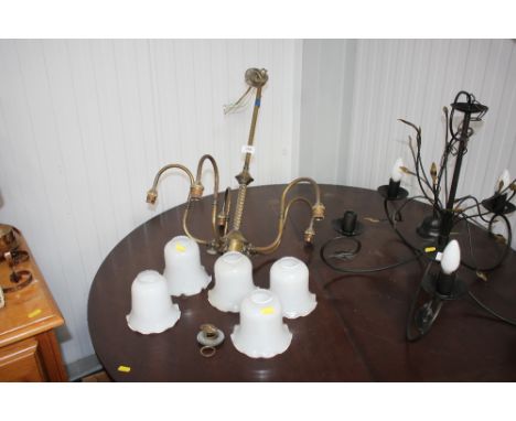 A brass, five branch chandelier with five milk glass shades