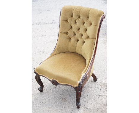 Late 19th century mahogany button back nursing chair with green upholstery and carved acanthus leaf detail, approx 89cm tall 