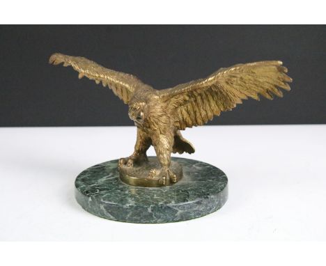 Gilt bronze model of an Eagle perched on a circular marble base, approx 13cm tall 