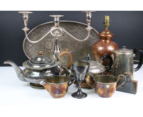 Collection of silver-plated items to include a gallery tray, candelabra, silver plated teapot, tea set, and Indian brass lamp