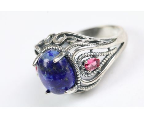 A ladies silver and blue stone ring, marked 925 to the shank. 