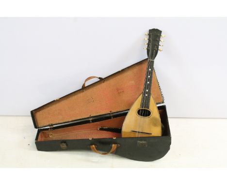 Eight string mandolin with mother of pearl detail, cased, with spare strings 