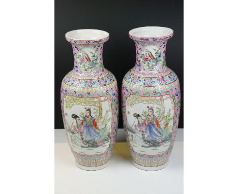 Pair of Chinese famille jaune vases of baluster form decorated with panels depicting two Chinese figure by a tree, on a flora