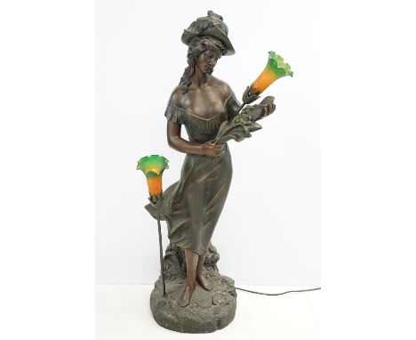 Art Nouveau style bronze effect resin floor standing lamp modelled as a lady, the two lights with green &amp; orange floral s