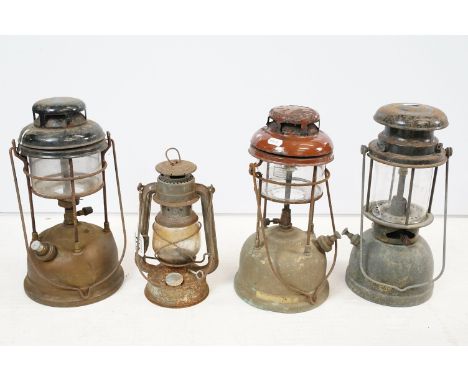 Two Tilley paraffin / kerosene lamps, each 34cm high (excluding handle), a Bialaddin paraffin / kerosene military lamp, with 