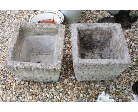 Pair of reconstituted stone garden planter pots of square form with moulded brick exterior. Measures 32 x 38cm. 