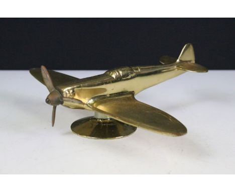 Brass desk top model of an airplane on stand 