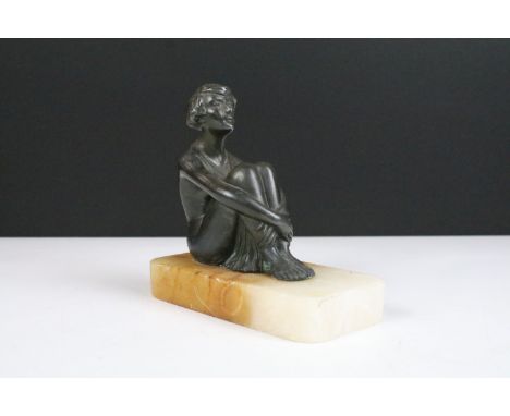 Art Deco style bronze figure of a nude female seated, registered number to back indistinct, mounted on an alabaster base, 11c