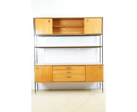 Avalon mid century teak unit, with two sliding cupboard doors and open shelving to upper section, above a shelf, the base wit