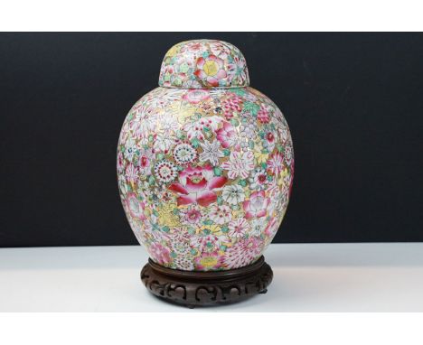 Chinese famille rose vase &amp; cover with floral decoration of gilt ground, four character seal type mark to base, raised on