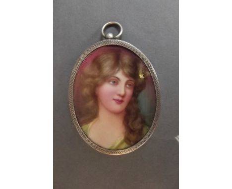 A miniature oval portrait on porcelain or a young girl, signed 'Leslie Johnson' (Doulton artist), c1905, 3" long 