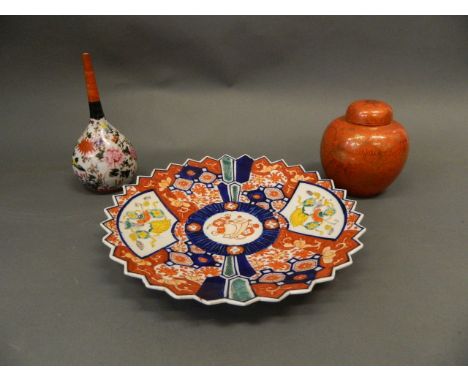 A C19th Imari plate with shaped rim, a Chinese ginger jar and cover with gilt highlights, and a Meiji period porcelain bud va