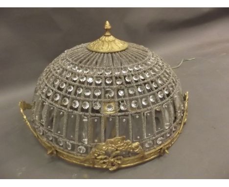 A circular gilt and crystal ceiling light with cast metal mounts, 19" diameter 