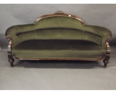 A Victorian walnut Aesthetic style sofa with carved decoration, scroll arms and shaped back, on turned supports, 72" wide 