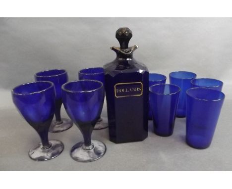 A C19th Bristol blue glass spirit decanter marked 'Hollands' in gilt, together with four wine glasses and five thimbles, deca