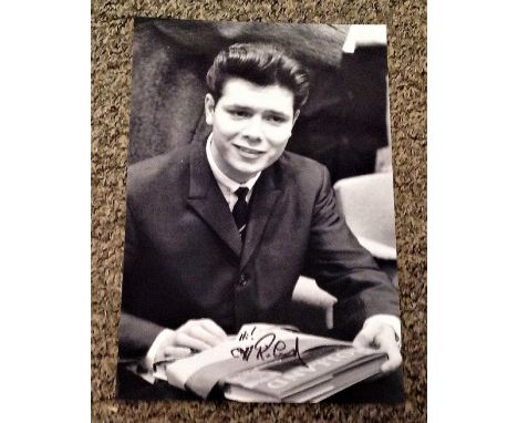 Cliff Richard signed 12x8 black and white. Sir Cliff Richard OBE (born Harry Rodger Webb; 14 October 1940) is a British singe