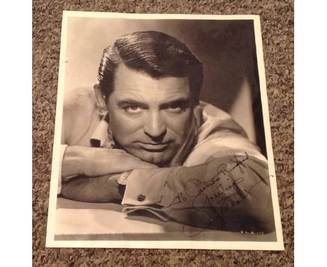 Cary Grant signed 10x8 vintage black and white photo dedicated. Cary Grant (born Archibald Alec Leach; January 18, 1904 - Nov