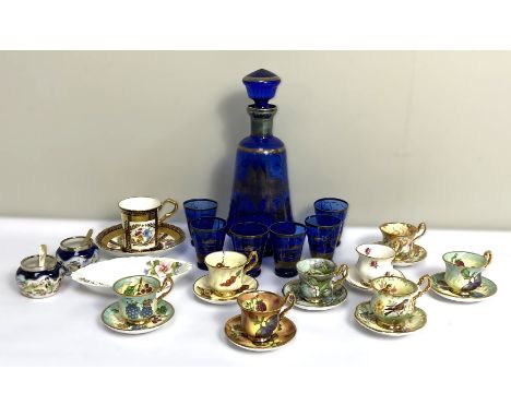 A selection of novelty miniature tea cups and saucers, also an attractive blue glass liqueur set (a lot)