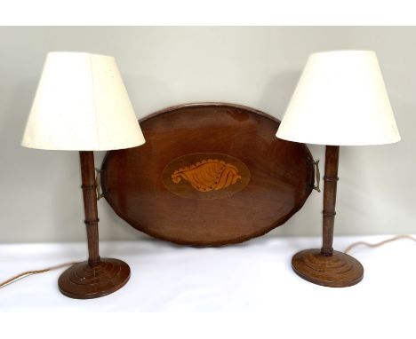 A George III style mahogany oval tea tray, 19th century, with inlaid shell; also a pair of turned wooden lamp bases (3)