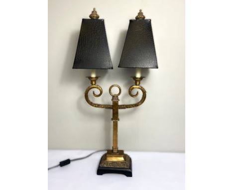 A gilt metal 19th century style twin light table lamp stand, with scrolled arms