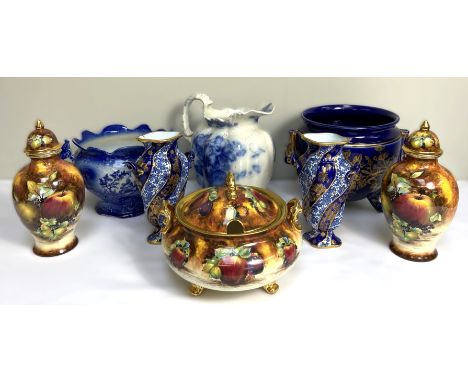 A pair of Worcester style baluster vases, decorated with fruit, together with a group of assorted vases, jugs and basins (a l