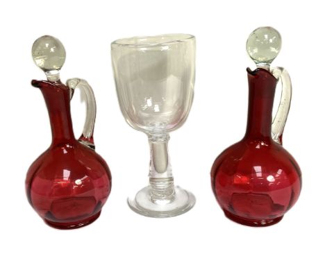 A good pair of vintage Ruby glass ewers, together with a very large glass goblet, probably mid 19th century with baluster ste