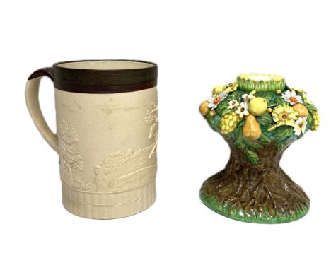 A Booth’s china lamp base, ornately decorated with fruit and flowers, 15cm high; also a splendid large stoneware tankard, 19t