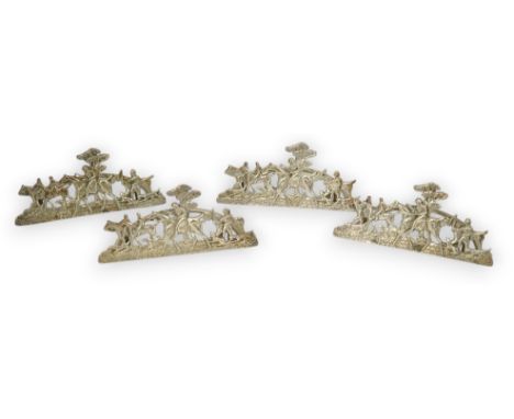 A set of four Edwardian pierced silver 'hunting scene' menu holders, by Stuart Clifford, London, 1902, 84mm.  Overall conditi