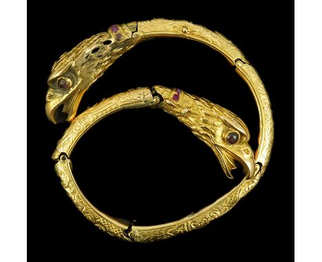 An antique Russian? engraved gold, garnet and ruby cluster set double headed eagle open hinged bracelet, with six hinged sect