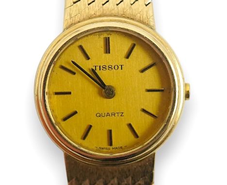 A lady's early 1980's 9ct gold Tissot quartz wrist watch with textured 9ct gold associated bracelet, overall length 16.5cm, g