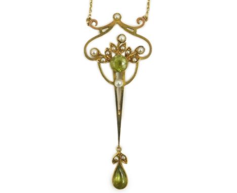 An early 20th century style gold, peridot and seed pearl set drop pendant, on an 18k gold chain, pendant 55mm, chain 40cm, gr