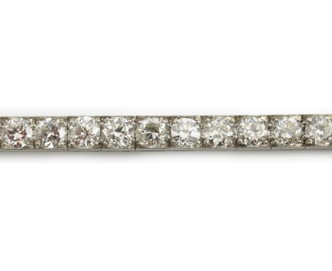 A mid to late 20th century and diamond line bracelet, set with thirty three round brilliant cut stones, each weighing approxi