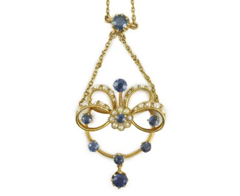 A mid 20th century gold, sapphire and seed pearl cluster set drop pendant necklace, 46cm, gross weight 9.2 grams.  Two knots 