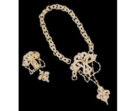 A cased 19th century seed pearl cluster mounted mother of pearl demi parure, comprising a brooch and drop necklace, both with