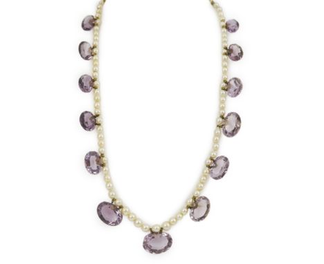 A 19th century pearl and graduated fifteen stone oval cut amethyst set drop necklace, with a gold barrel shaped clasp, 42cm. 