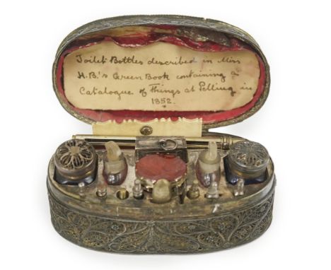An early 19th century filigree silver writing/etui set, of rectangular form, containing seventeen accoutrements including pou